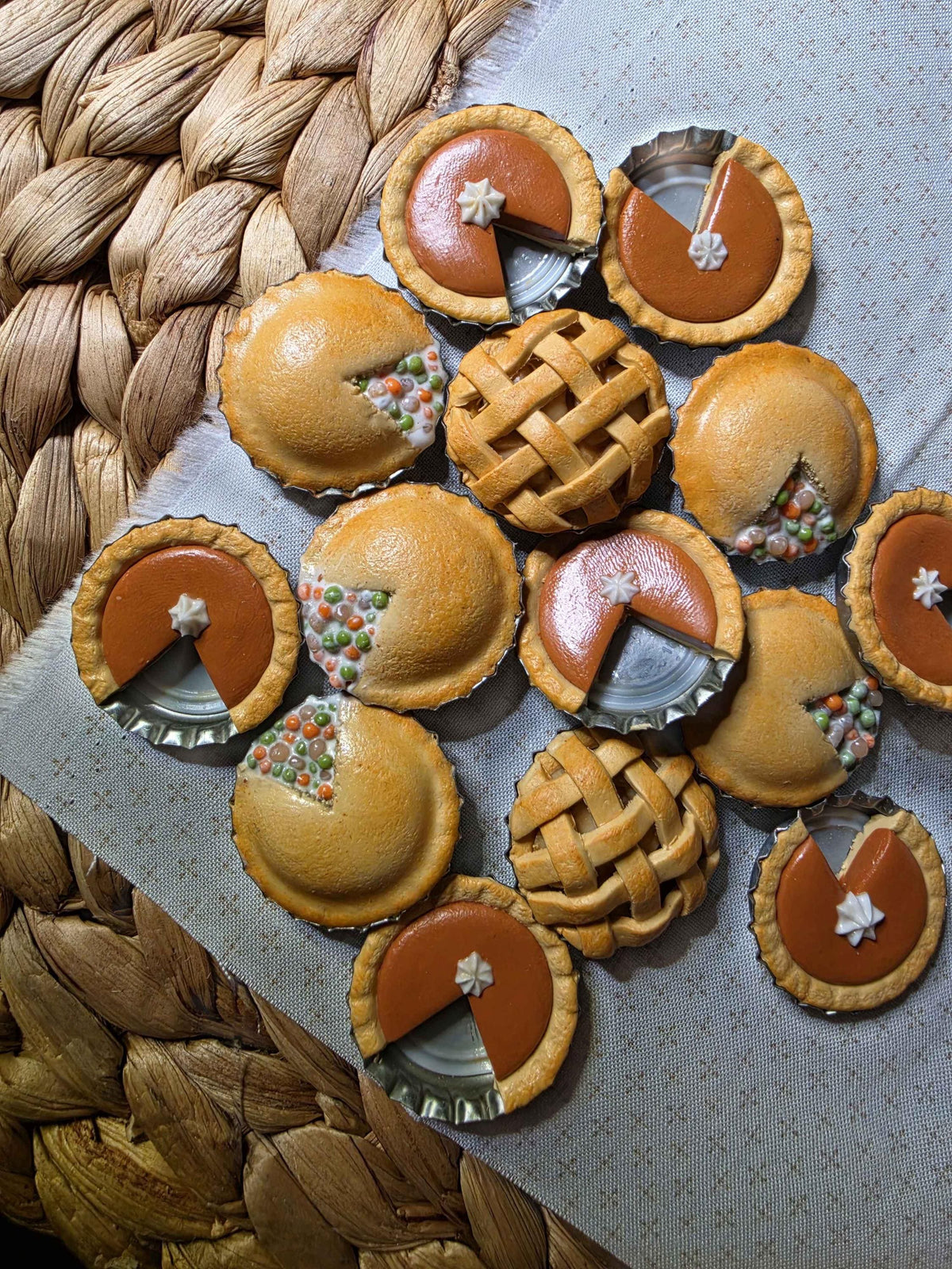 Collection of handmade polymer clay mini pie magnets: pumpkin pies, lattice apple pies and pot pies