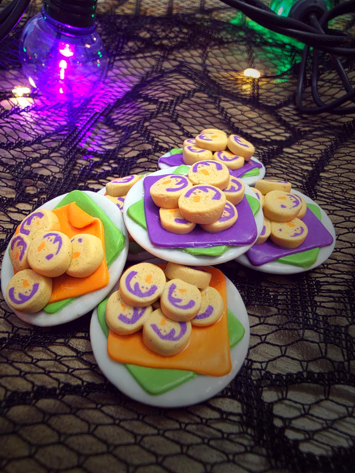 Miniature Halloween ghost cookie plates with purple/green and orange/green napkins, polymer clay dollhouse food