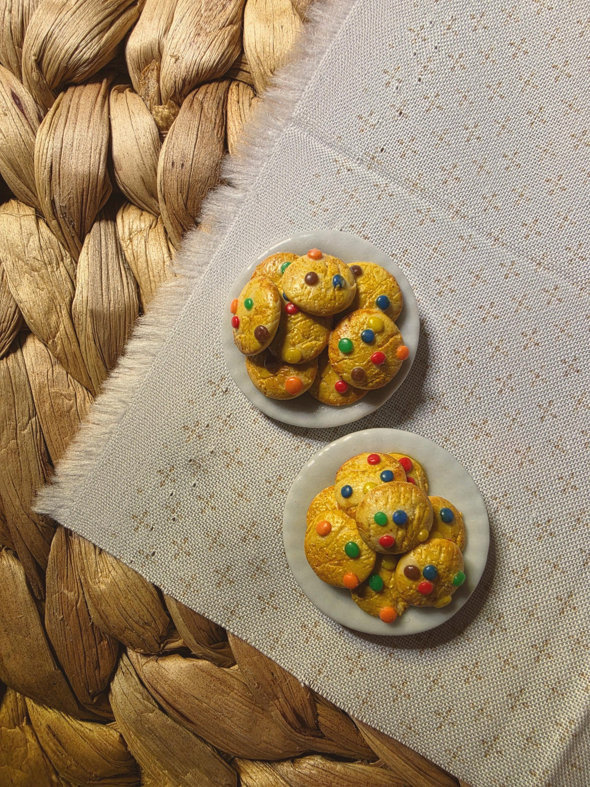 Handmade miniature candy cookie plates on a woven mat, polymer clay dollhouse miniature